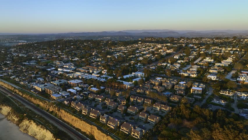 Aerial view of oceanside neighborhood in San Diego, sunset in CA, USA - reverse, drone shot Royalty-Free Stock Footage #1100808457