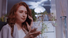 (Camera: ARRI ALEXA, real time) A young caucasian woman is talking on her cell phone, having a neutral conversation. For more variations of this clip, check out this seller's other videos.
