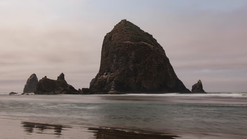 The famous landmark Haystack Rock in Cannon Beach at the Oregon Coast