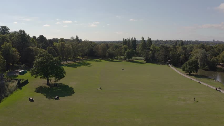 Cannon Hill Park, Birmingham on a glorious summer day. 4k Drone shot of the South end of the parkland.