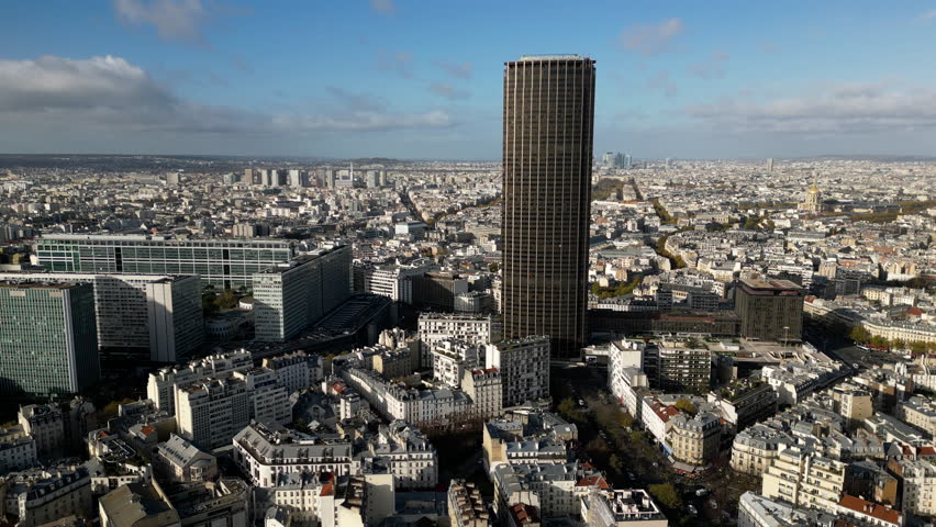 Montparnasse tower and cityscape with Tour Eiffel in background, Paris in France. Aerial drone panoramic view