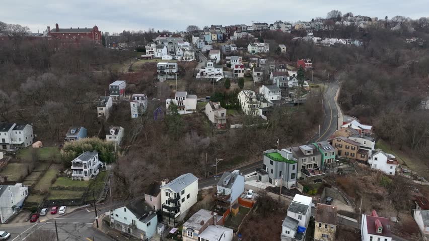 Houses on Mount Washington in Pittsburgh. Mountainous and hilly housing neighborhood in Pennsylvania. Aerial truck shot.