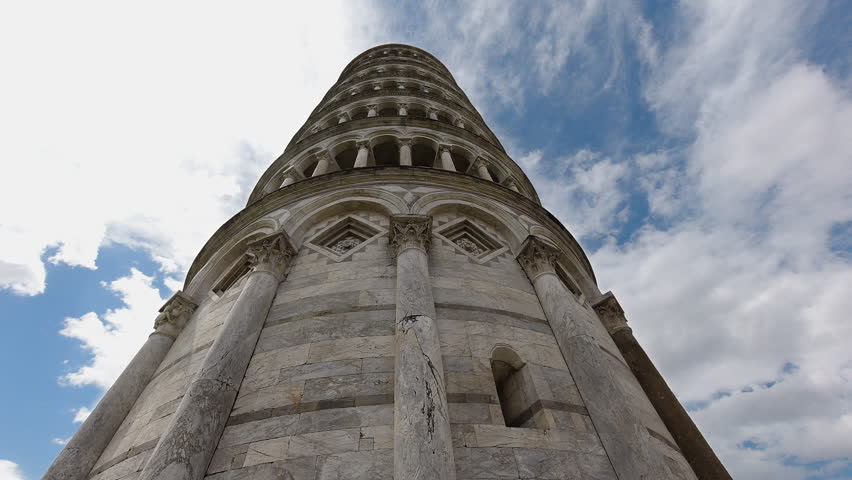 Iconic leaning tower of Pisa - upwards view at clouds in blue sky; time lapse Royalty-Free Stock Footage #1100812603