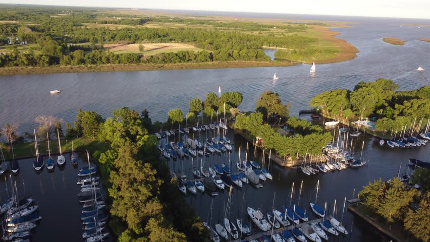 San Isidro Yacht club along Rio de la Plata river at sunset. Aerial panoramic view of maritime route between Buenos Aires in Argentina and Montevideo in Uruguay