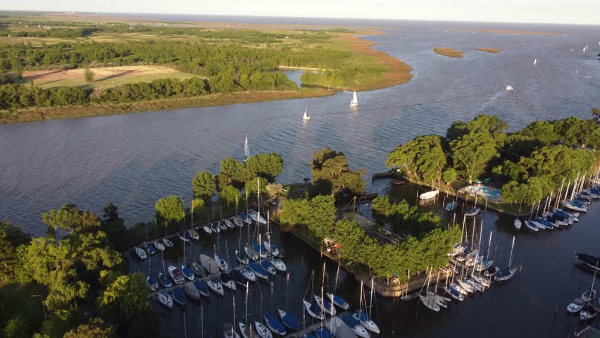 San Isidro Yacht club along Rio de la Plata river at sunset. Aerial panoramic view of maritime route between Buenos Aires in Argentina and Montevideo in Uruguay