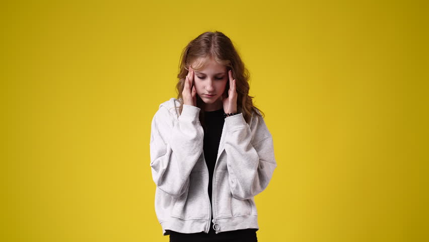 4k video of one girl feeling bad over yellow background. | Shutterstock HD Video #1100814911
