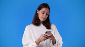 4k video of one girl sending messages on blue background.