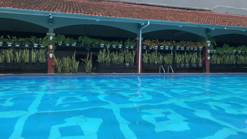 Swimming Pool at a Resort.Tropical vacation concept.4k.