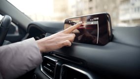 Driver Touching Navigation Screen In Car Dashboard. Car Cockpit Scrolling Screen Information System. Modern Luxury Car Interface Navigator Touchscreen. Driver On SUV Vehicle Dashboard Menu. Modern Car - Powered by Shutterstock - Get 15% off with code: PIKWIZARD15