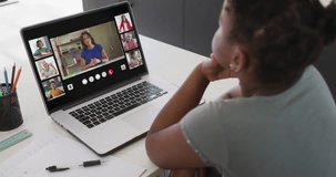 African american girl using laptop for video call with female teacher and class on screen. Communication technology and online education, digital composit video.