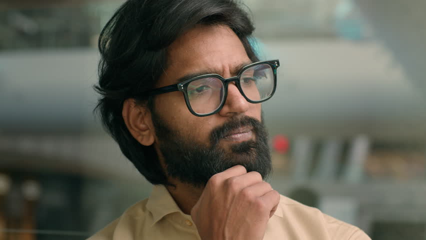 Thoughtful Arabian businessman thinking of business challenge rise finger come up with idea. Pensive Indian bearded man in glasses lost in thoughts think happy with solving problem insight gesture Royalty-Free Stock Footage #1100819213