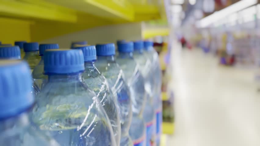 Blue water plastic in supermarket. Blue water a plastic supermarket. drink food. the problem of lack of drinking water in the world lifestyle