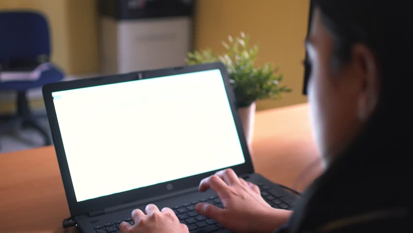 Woman writing on the keyword of her laptop at home.  Worker using notebook computer working for social distancing meeting online with social media application. Work from home COVID-19 concept.  Royalty-Free Stock Footage #1100824303