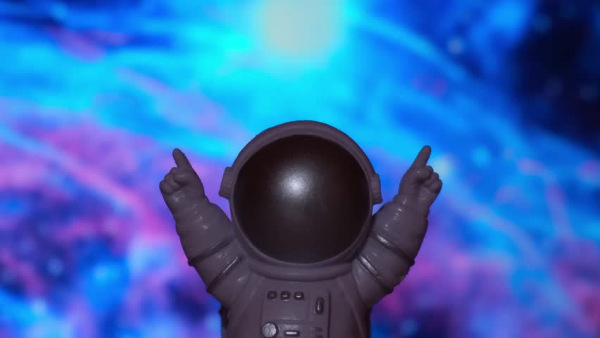 Astronaut Toy Spaceman on background of space. The concept of space and space flights commercial flights. Study of planets | Shutterstock HD Video #1100824533