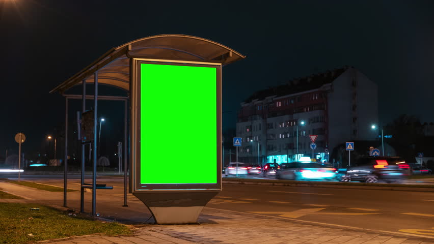 City street bus stop advertising billboard green screen mockup at night, time lapse footage Royalty-Free Stock Footage #1100826143