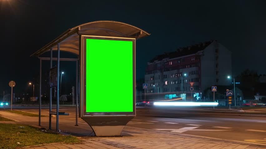 City street bus stop advertising billboard green screen mockup at night, time lapse footage Royalty-Free Stock Footage #1100826143