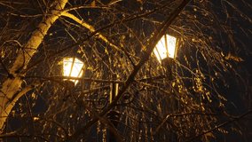 Burning lantern, falling snowflakes against the background of the night sky. - Powered by Shutterstock - Get 15% off with code: PIKWIZARD15