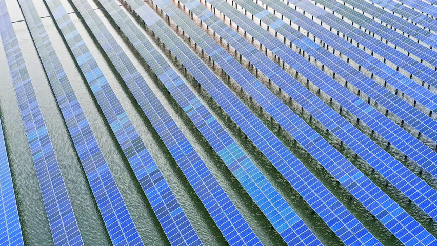 Aerial footage of solar power station. solar photovoltaic power station on water. green energy concept. | Shutterstock HD Video #1100829459