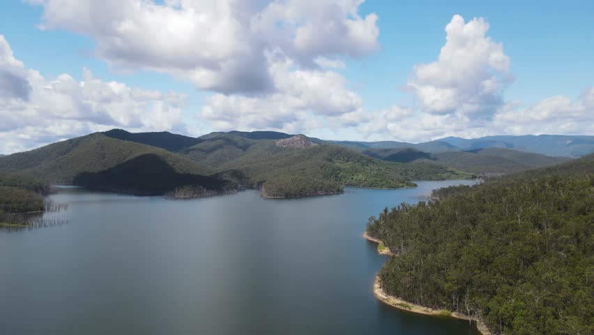 Pages Pinnacle a tertiary rhyolite volcanic plug on a ridge with Hinze Dam below. Gold Coast Australia