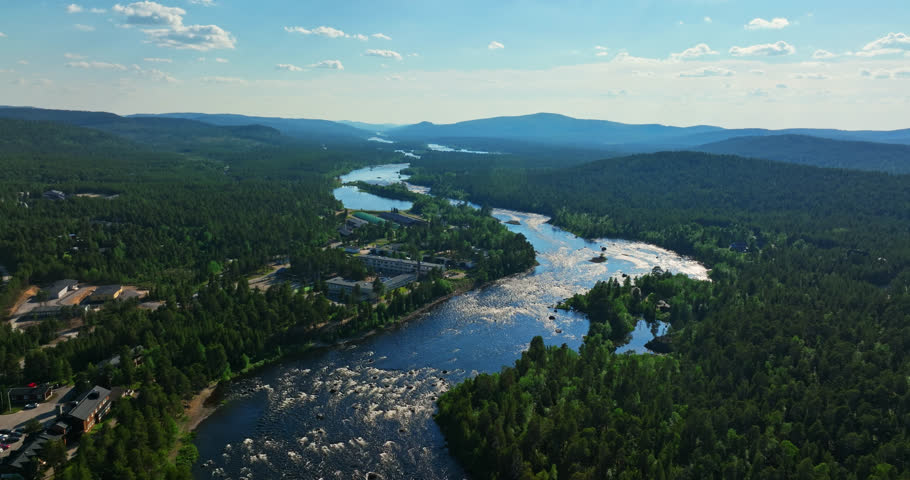 Aerial view overlooking the Janiskoski rapids, summer in Inari, Finland - reverse, drone shot