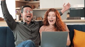 Young amazed family happy couple use laptop read news online received great e-mail scream with joy celebrating unbelievable opportunity hugging each other. Lottery win, auction, betting success. - Powered by Shutterstock - Get 15% off with code: PIKWIZARD15