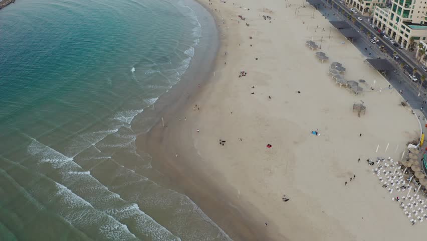 4k Aerial - Blue waves, boardwalk - Tel aviv beach during sunset