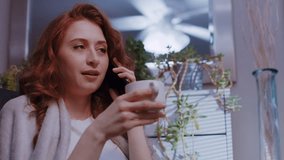 (Camera: ARRI ALEXA, real time) A young caucasian woman is talking on her cell phone, and receives bad news. For more variations of this clip, check out this seller's other videos.