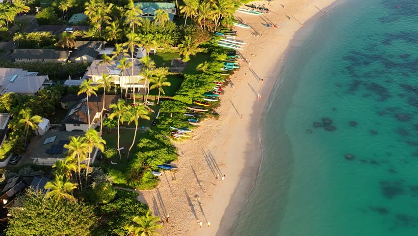 birds eye view aerial drone of lanikai beach in lanikai hawaii at sunrise beautiful clear beach water palm trees canoes reef paradise oceanfront property