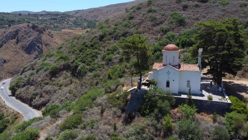 Church of Agios Panton in Topolia village, Crete, overlooking Greek mountain valley, Aerial view