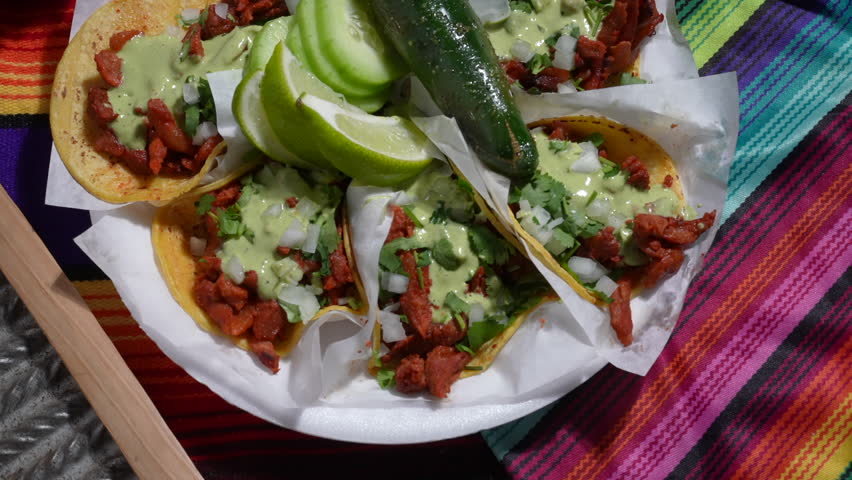 Soft shell tacos, chili pepper, lime cucumbers on a plate - food truck series