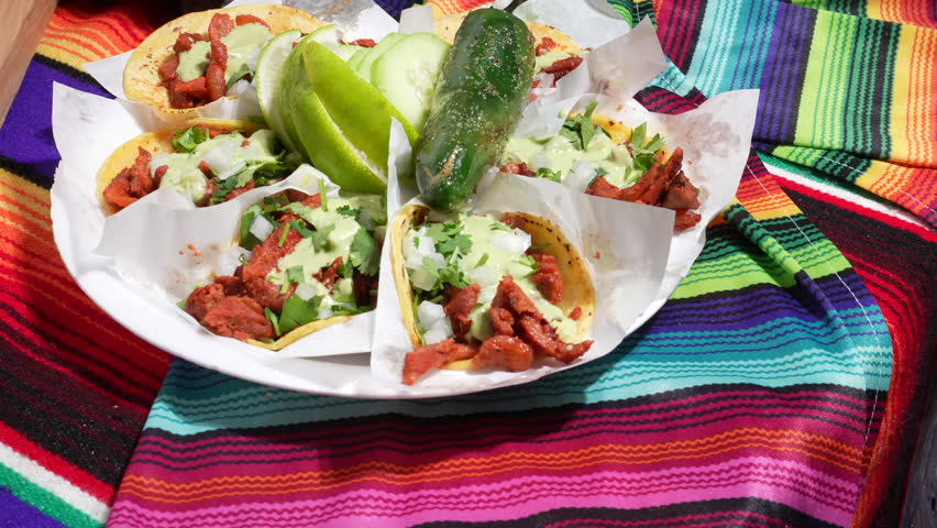 Plate of pulled pork street tacos, lime, chili pepper - food truck series