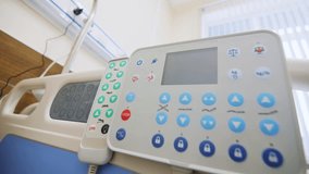 Bed with operating apparatus for monitoring patient health condition in clinic ward. Equipped room for treatment in innovative hospital - Powered by Shutterstock - Get 15% off with code: PIKWIZARD15