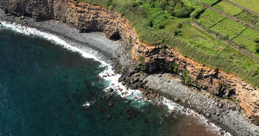 Waves Crashing On The Rocky Coastline Feteira Hamlet In Terceira Island, Portugal. - aerial