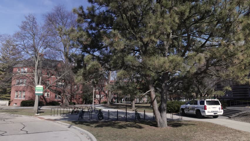Berkey Hall on the campus of Michigan State University with a police car in front. The site of a mass shooting in February, 2023.