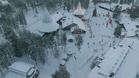 Santa Claus Village Shooting at Santa Claus near Rovaniemi in Lapland - Finland. Ice hotel with ice bar and restaurant services. carved ice walls. drone videos. Night at Santa Claus. Lights and snow.  - Powered by Shutterstock - Get 15% off with code: PIKWIZARD15