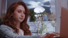 (Camera: ARRI ALEXA, real time) A young caucasian woman is working from home on her laptop, receives some bad news. For more variations of this clip, check out this seller's other videos.