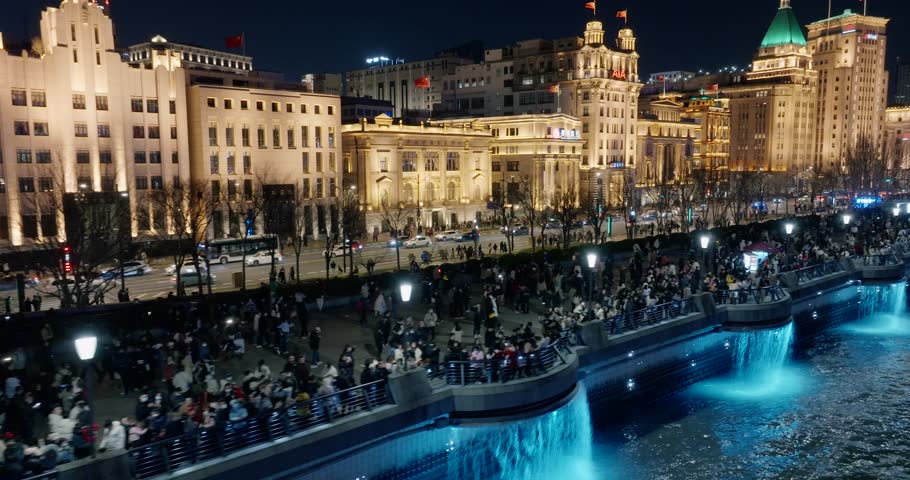 Aerial view of The bund in Shanghai at night.Exotic building clusters in the Bund of Shanghai，Tourists enjoy the view of the city from the sightseeing platform.