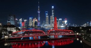 Shanghai Skyline at Night. Urban Lujiazui District, Huangpu River and Waibaidu Bridge. China. Drone footage.