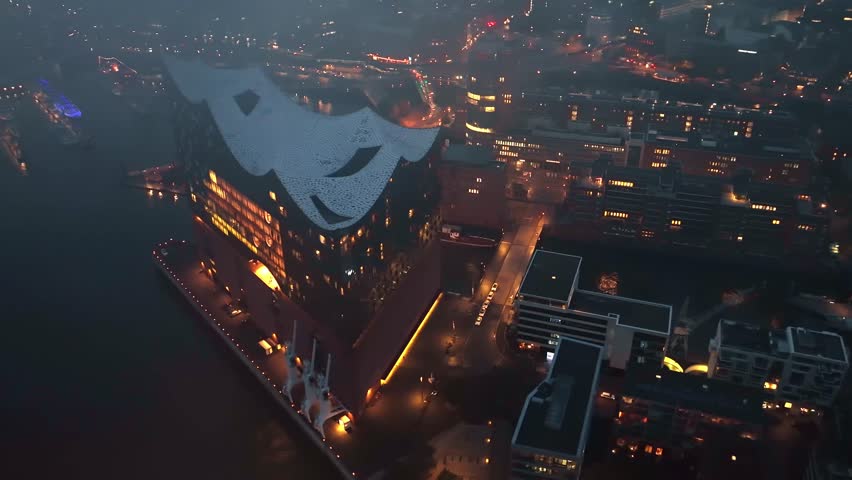 Establishing Aerial View Shot of Hamburg De, Mecklenburg-Western Pomerania, Germany, at night evening, rathaus, city falling asleep