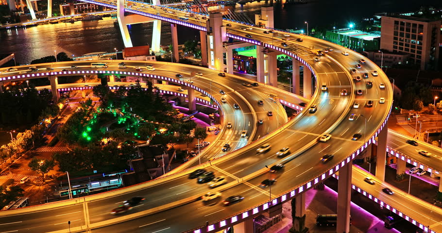 Multi storey highway overpass. busy urban transportation at night in Shanghai, China.