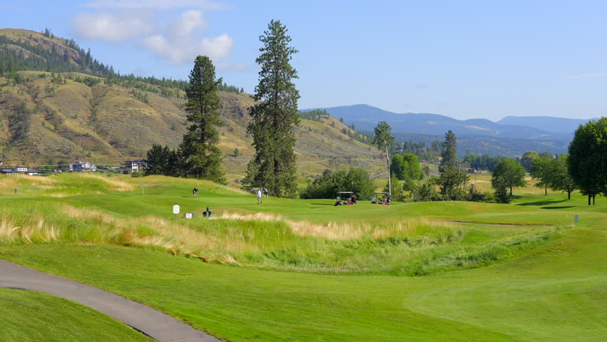Establishing shot of golf course with gorgeous green and fantastic forest view in Vancouver, Canada, North America. Day time on May 2022. Still camera. ProRes 422 HQ. Royalty-Free Stock Footage #1100883197