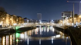 Dublin Ireland Ha'Penny Bridge and River Liffey at Night with Traffic Timelapse Video