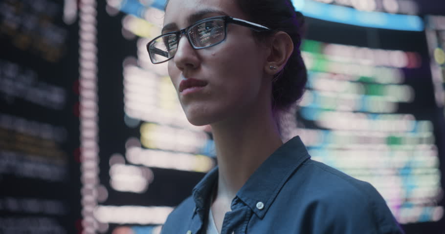 Close Up Portrait of Woman Working on Computer, Lines of Code Language Reflecting on her Glasses from Big Display Screens. Female Programmer Developing New Software, Coding, Managing Cybersecurity Royalty-Free Stock Footage #1100883599