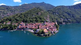 One of the most beautiful lakes of Italy - Lago di Como. aerial drone video of beautiful Varenna village, popular tourist attraction . Lombardy region
