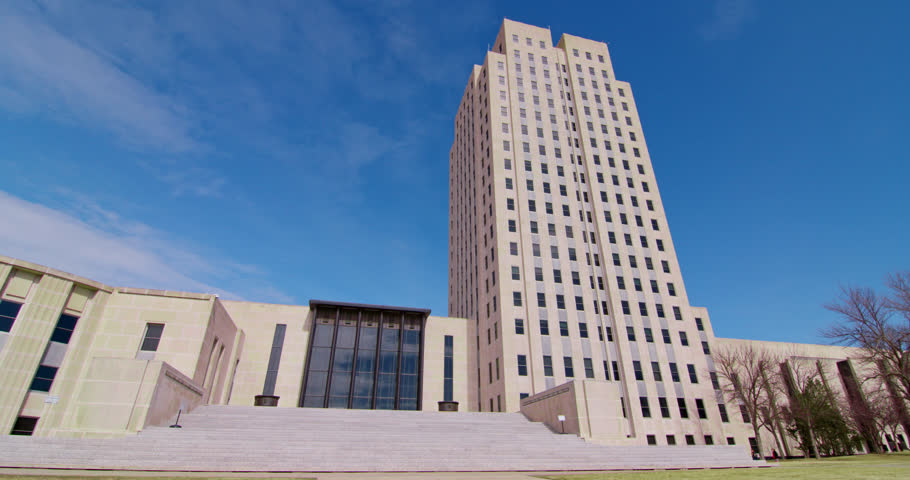 North Dakota State Capitol building, North Dakota, United States, Establishing Shot Low Angle with Blue Skies Timelapse
