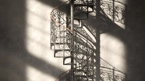 Beautiful black steel spiral staircase with ornamented steps. The camera moves upwards. Piece of vintage decorated architecture construction. Seamless, endless looping animation. - Powered by Shutterstock - Get 15% off with code: PIKWIZARD15