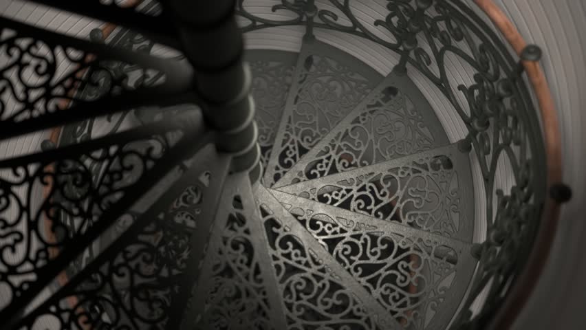 Beautiful black steel spiral staircase with ornamented steps. Camera moves upwards. White brick wall tower. Piece of vintage decorated architecture construction. Seamless, endless looping animation.