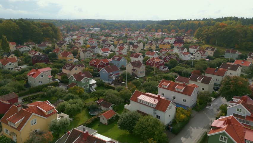 Family homes in Stockholm, Sweden. Fly-over drone shot. Royalty-Free Stock Footage #1100890147