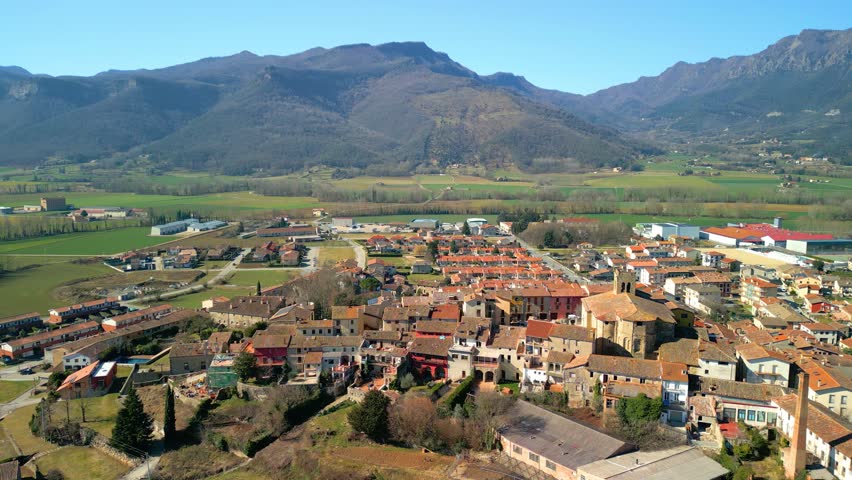 Aerial images of Vall d'en Bas in the province of Girona La Garrotxa area images of the city with the mountains in the background