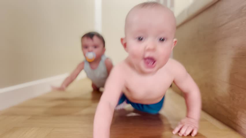 baby crawling. baby crawling on the floor smiling happy playing on the floor. happy family kindergarten newborn education concept. a group of babies crawling lifestyle on the floor Royalty-Free Stock Footage #1100892205
